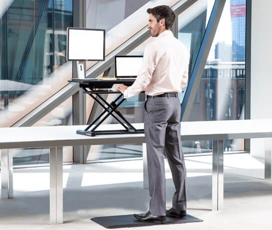 Benefits of Desk Risers & Sit-Stand Desks